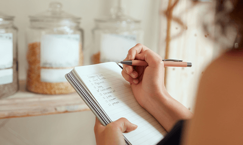 woman writing in diary