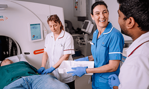 smiling radiographers with patient