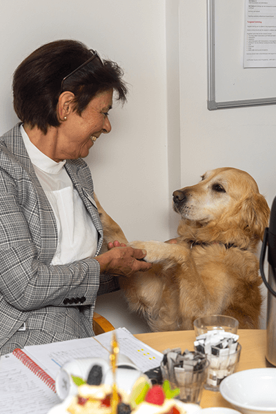 lady smiling with dog