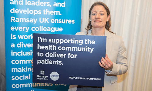 woman smiling with board of words