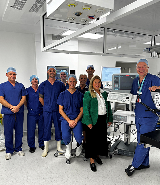 hospital staff smiling in a theatre